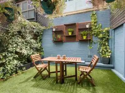 two chairs and one table shown in this image with home gardening